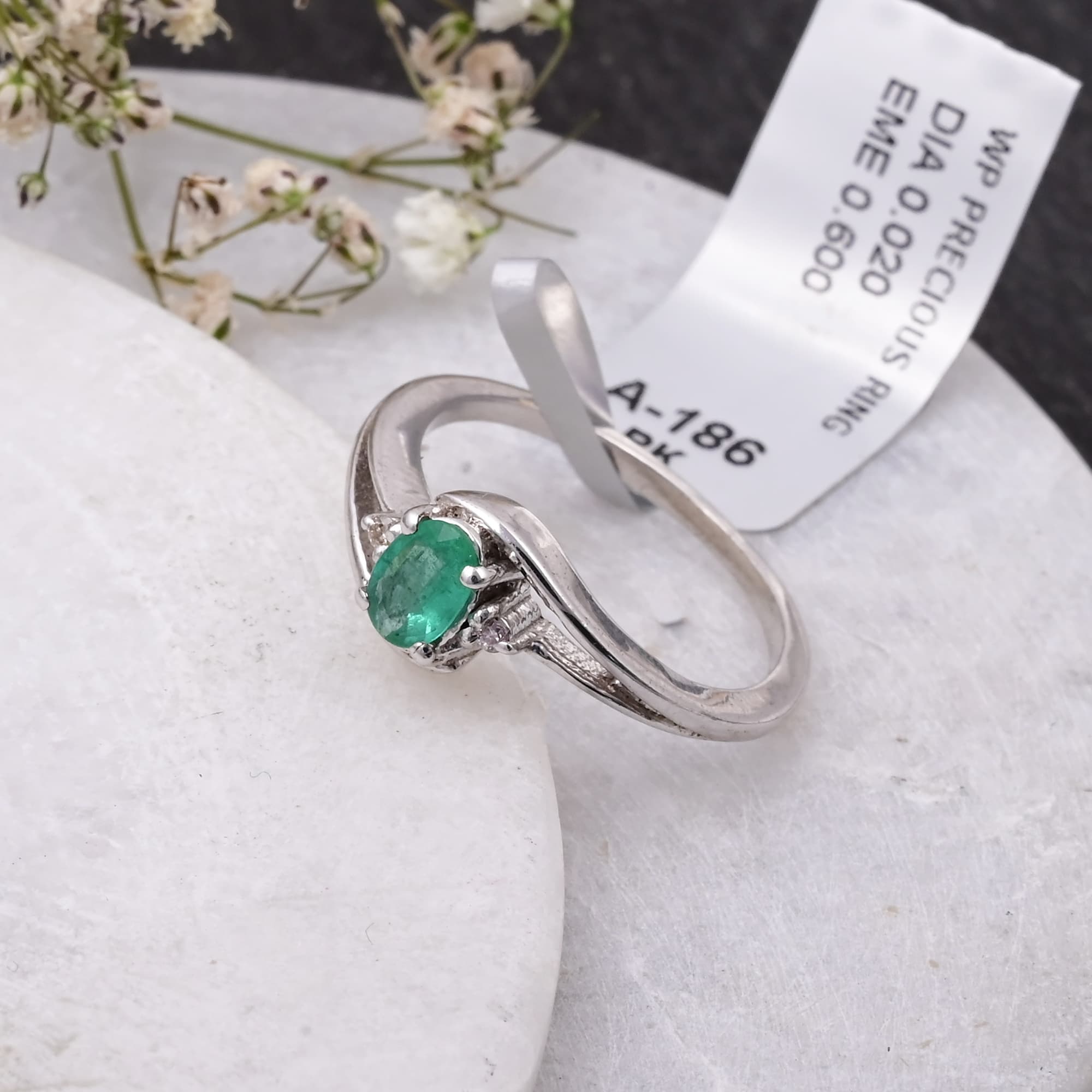 Emerald Whisper Twist Ring